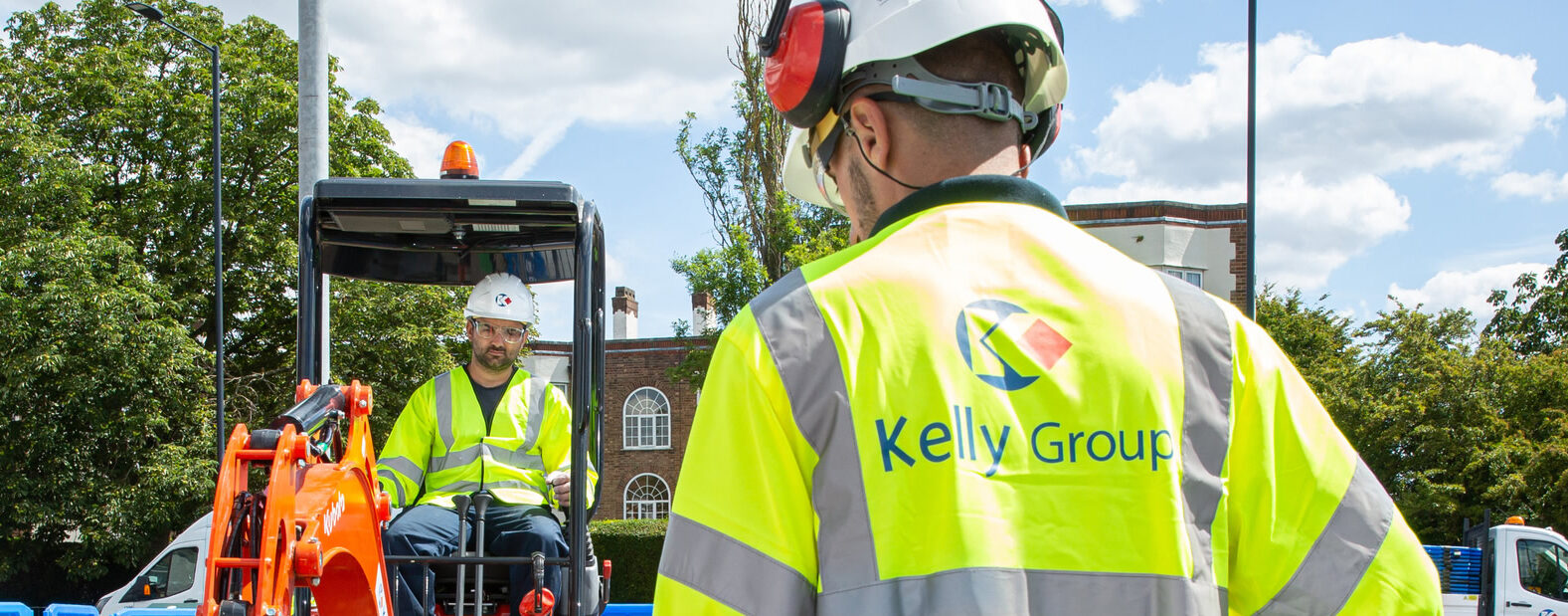 Kelly Group operative supervising civils training with excavation equipment